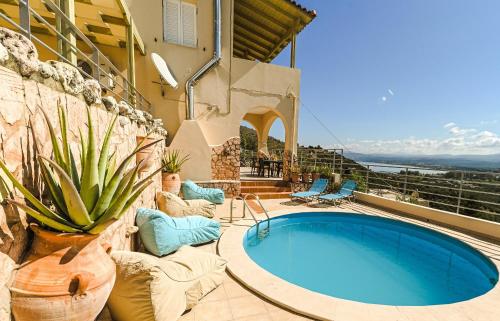a house with a swimming pool on a patio at Aloe Villa Chania Crete in Georgioupolis
