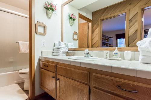 a bathroom with a sink and a mirror at Snowcreek #474 in Mammoth Lakes