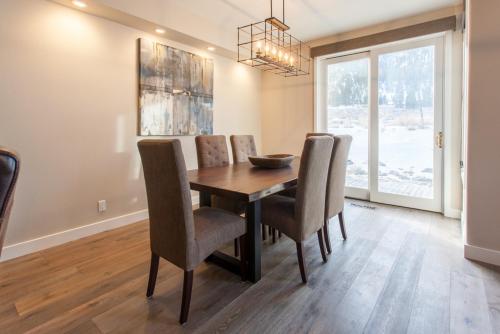 a dining room with a wooden table and chairs at Snowcreek #754 - Phase V in Mammoth Lakes