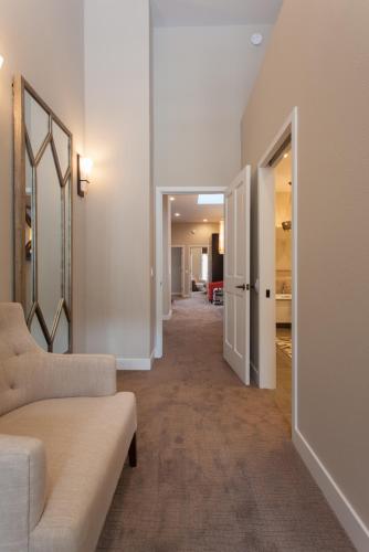 a hallway with a living room with a couch at Snowcreek #754 - Phase V in Mammoth Lakes