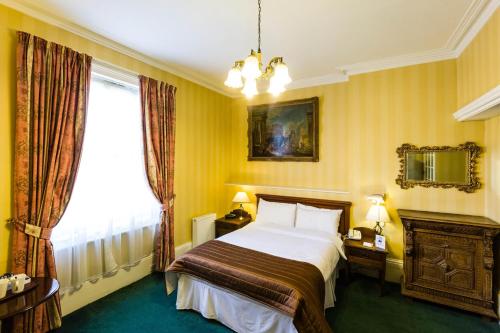 Postel nebo postele na pokoji v ubytování Best Western Swiss Cottage Hotel
