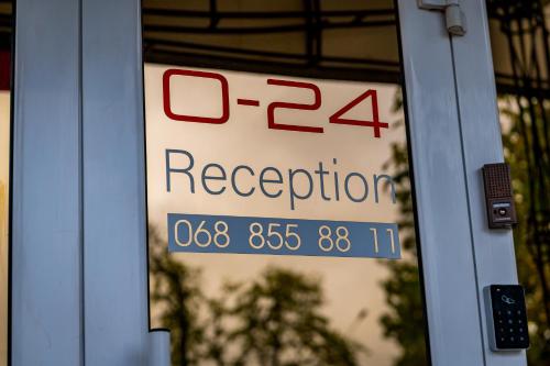 a sign on the door of a building at Rooms Hotel in Vinnytsya