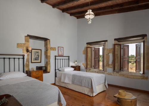 A bed or beds in a room at The Quintessential Cretan Villa