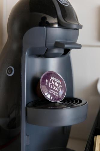 a sticker sitting on top of a coffee machine at Century Park in Nelson