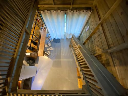 an overhead view of a room with a curtain at Rosa Lodge Lofts in Praia do Rosa