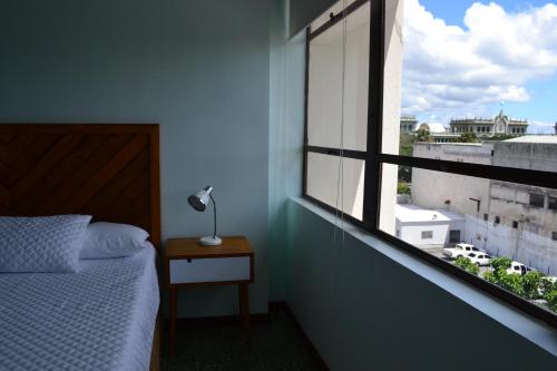 Cama o camas de una habitación en Apartamentos el Prado en Zona 1 - ANAH hotel group