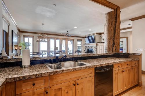 a kitchen with a sink and a counter top at Villa Montane by East West Hospitality in Beaver Creek