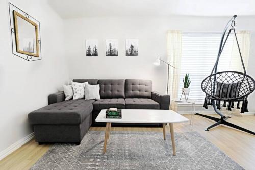 a living room with a couch and a coffee table at Global Cup The Resting Space - FREE ARBORETUM TICKETS in Dallas