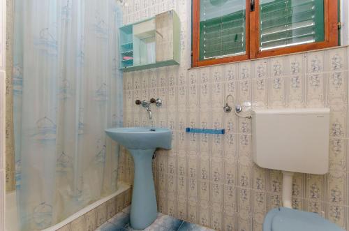 Koupelna v ubytování Apartments Moloco
