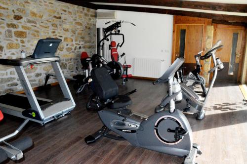 a gym with several exercise equipment in a room at Quinta do Olival in Vilas Boas