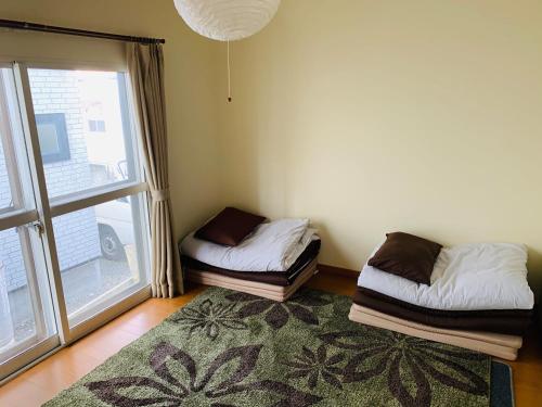 Krevet ili kreveti u jedinici u okviru objekta Guesthouse TOMAYA