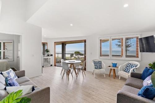 a living room with a couch and chairs and a table at Sea Salt - Lennox Head in Lennox Head