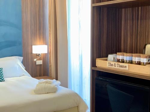 Postel nebo postele na pokoji v ubytování Hotel Brescia
