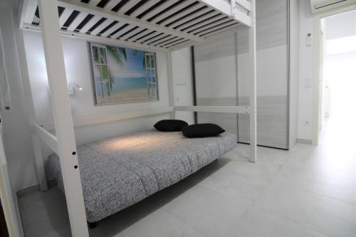 Tempat tidur dalam kamar di Global Immo 1037 MEDA CHICA BX