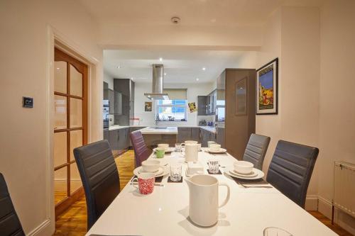 a kitchen and dining room with a table and chairs at Host & Stay - The View Old Coastguard Cottage in Tynemouth