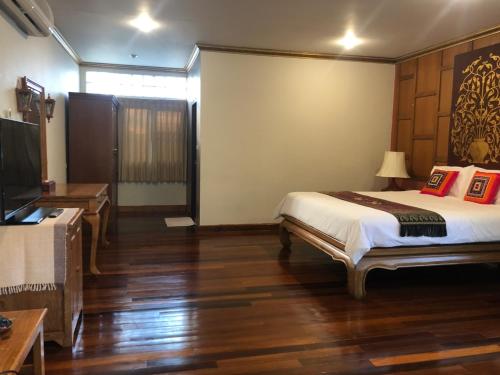 Ένα ή περισσότερα κρεβάτια σε δωμάτιο στο Hotel Siblanburi Resort