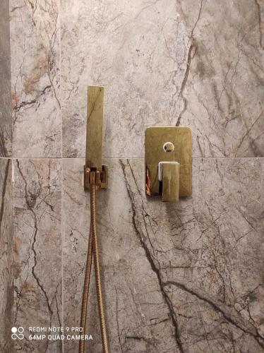 a metal switch on a stone wall at Bošket Luxury Rooms in Split