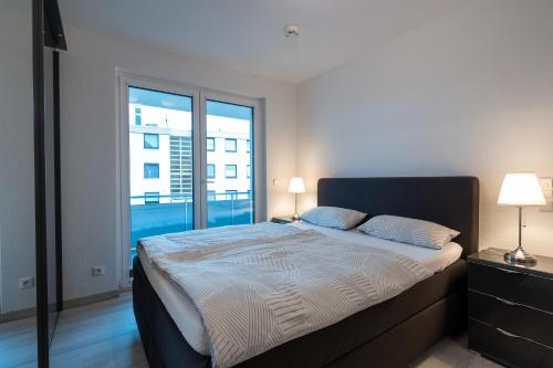 Ένα ή περισσότερα κρεβάτια σε δωμάτιο στο Apartement Laatzen nähe Messe