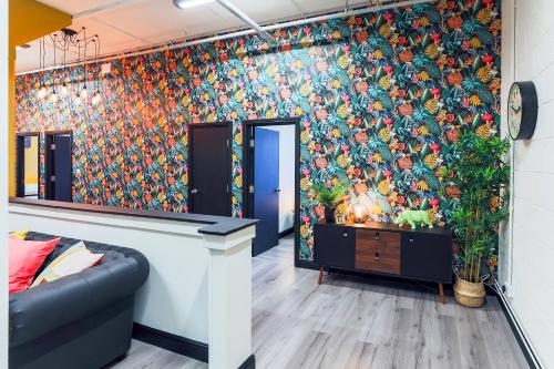 a room with a wall mural of pumpkins at The DreamArt Warehouse in London