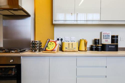 a kitchen with a counter top with some items on it at The DreamArt Warehouse in London