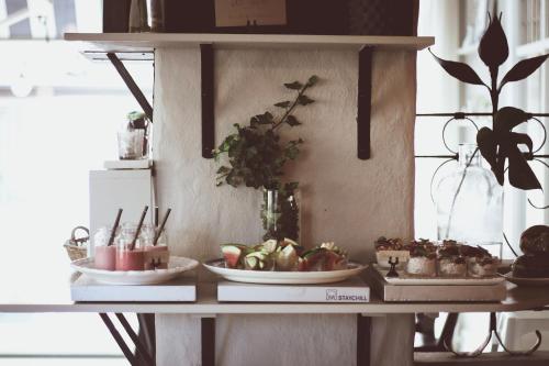 a shelf with two plates of plants on it at Hotell Villa Borgen in Visby