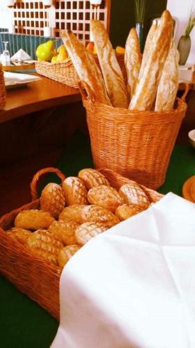 a basket of bread sitting on top of a table at Le Centell Hotel & Spa in Antananarivo
