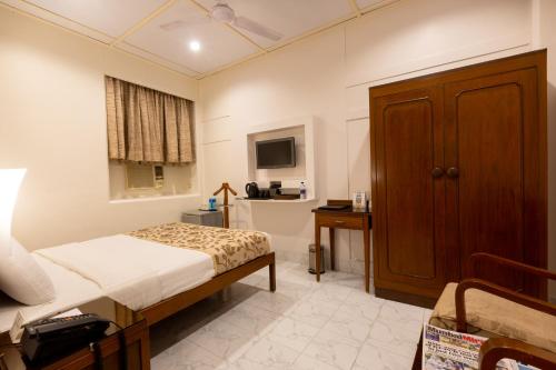 Postel nebo postele na pokoji v ubytování Grand Hotel Mumbai - Ballard Estate, Fort