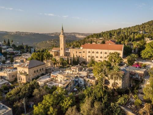 an aerial view of a city with a church at Flora Valley Boutique Hotel in Jerusalem