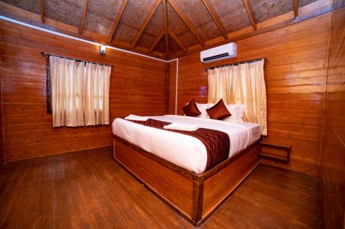 Postel nebo postele na pokoji v ubytování Tycoon Resort