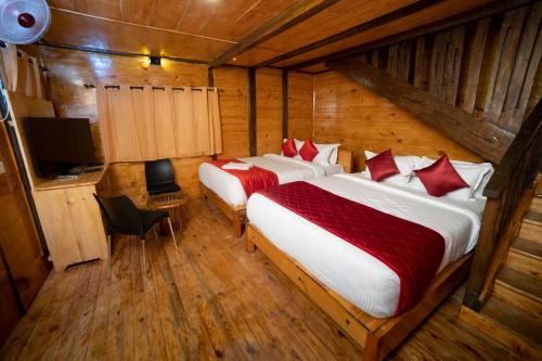Postel nebo postele na pokoji v ubytování Tycoon Resort