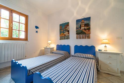Giường trong phòng chung tại Villa Medina - Goelba