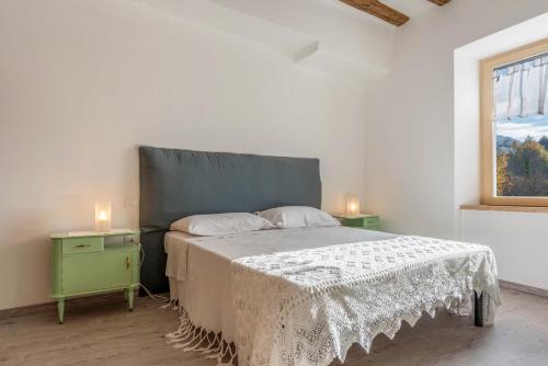 Postel nebo postele na pokoji v ubytování Casa di Ada