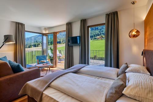 Ένα ή περισσότερα κρεβάτια σε δωμάτιο στο Hotel Mühlgarten