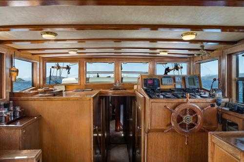 a view of a kitchen in a boat with windows at Four Seasons Hydra Luxury Suites in Hydra
