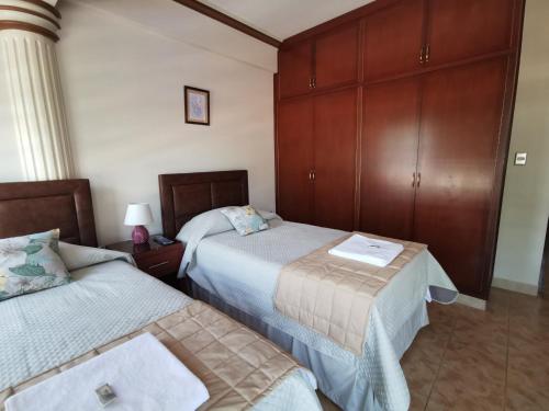 A bed or beds in a room at Hostal Palamas