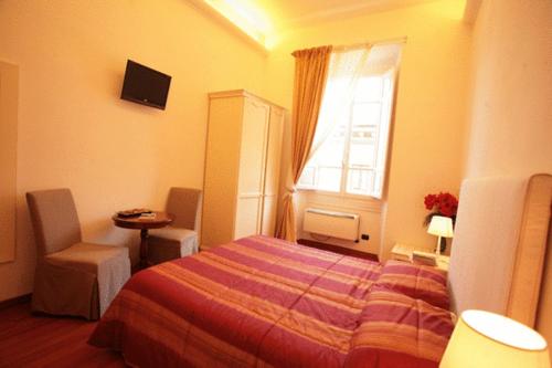 Кровать или кровати в номере B&B Magnifico Messere