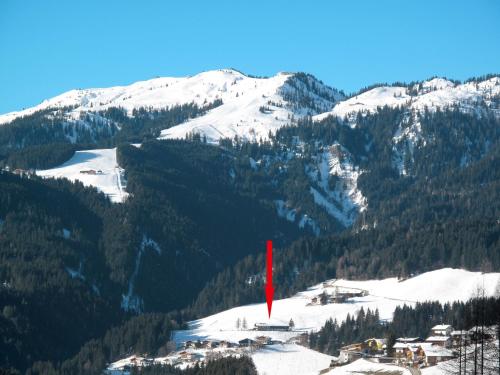 a red flag on top of a snow covered mountain at Holiday Home Schwalbenhof by Interhome in Oberau