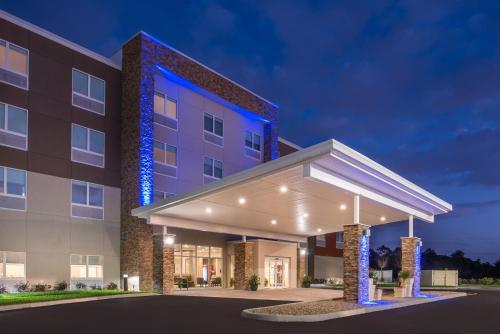 a rendering of the front of a hotel at night at Holiday Inn Express & Suites Alachua - Gainesville Area by IHG in Alachua