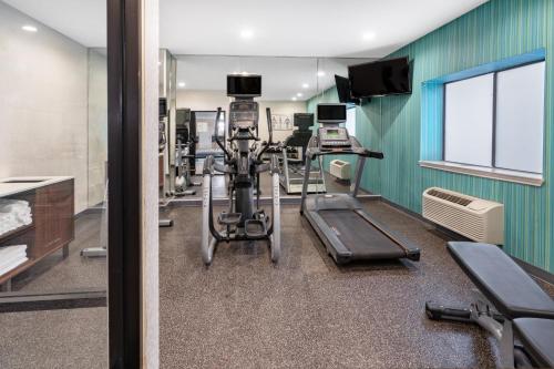 a gym with treadmills and machines in a room at Holiday Inn Express Hotel & Suites Albuquerque - North Balloon Fiesta Park by IHG in Albuquerque