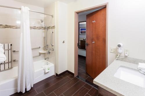 a bathroom with a sink and a shower at Holiday Inn Express & Suites Carpinteria by IHG in Carpinteria