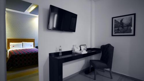 Ein Bett oder Betten in einem Zimmer der Unterkunft Six Hotel Guadalajara Expiatorio