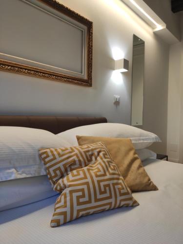 
Letto o letti in una camera di Borgo di Ponte Holiday Apartments & Rooms
