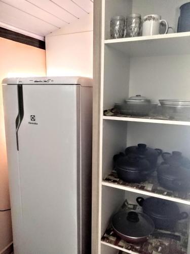 Kuchyň nebo kuchyňský kout v ubytování Aluguel casa Bombinhas