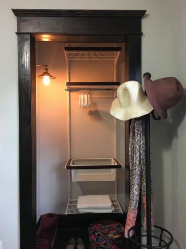 a hat sitting on top of a closet at Heavenly Suite in Little Havana Free Parking in Miami