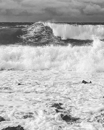 a group of breaking waves in the ocean at In Di House of Reggae Boutique in San Andrés