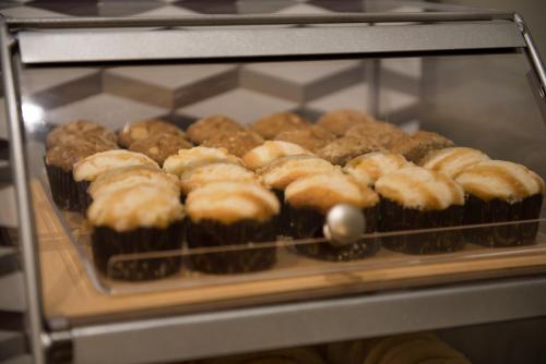 a bunch of donuts sitting in an oven at Holiday Inn Express & Suites - Mishawaka - South Bend by IHG in Granger