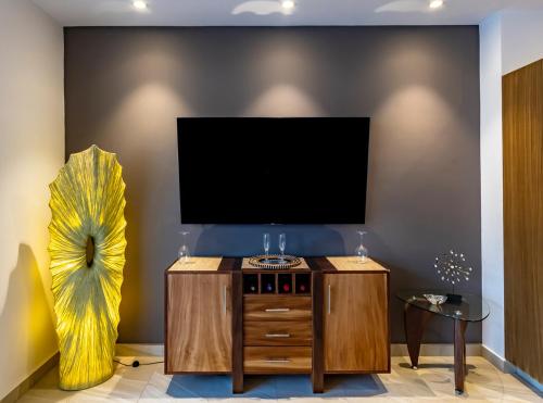 A television and/or entertainment centre at Urban Penthouse Living at Carranza