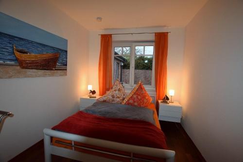 Ένα ή περισσότερα κρεβάτια σε δωμάτιο στο Ferienhaus-MEERzeit