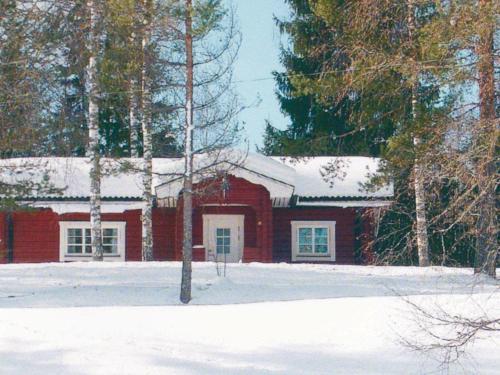 a red house with a snow covered roof at 4 person holiday home in TORSBY in Mårbacken