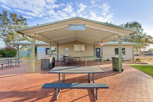 
a picnic table in front of a building at Discovery Parks - Port Augusta in Port Augusta
